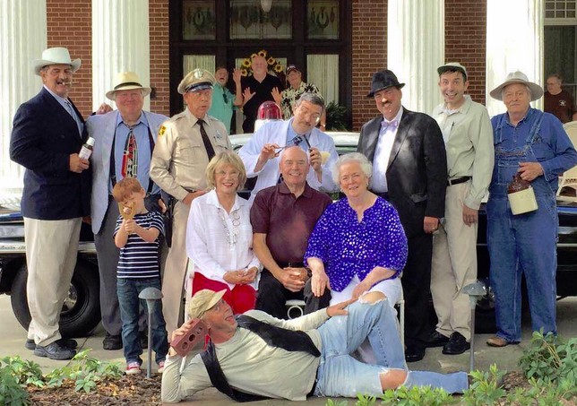 Maggie Peterson (seated, left) with some the of the Mayberry tribute artists, the VW Boys (in back), and other supporters of Mayberry Night in Troy, N.C., an event organized by Jeff Branch (seen here in the dark fedora as Howard Sprague tributer) that supports local DARE programs.